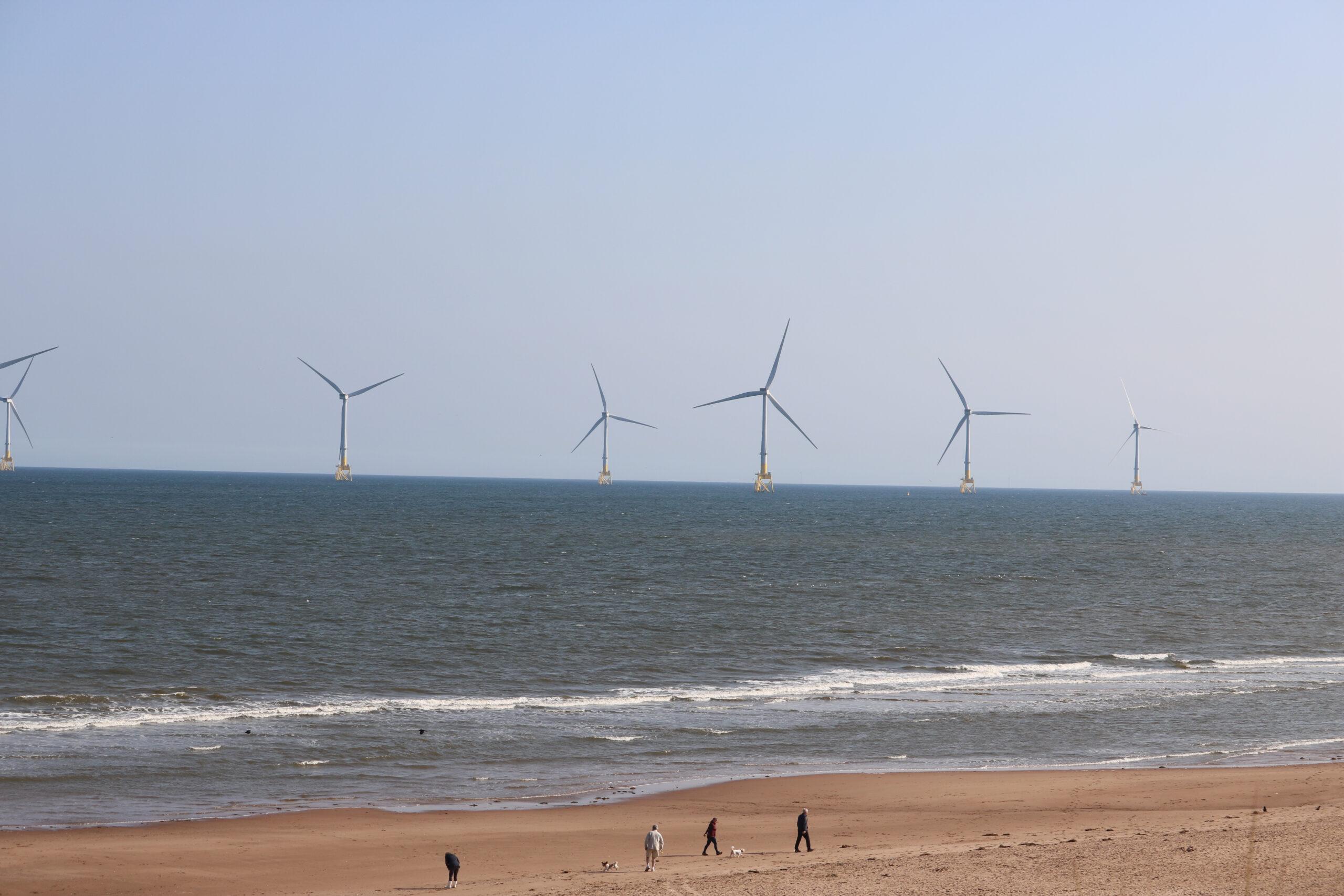 Offshore wind turbines seen from the beach