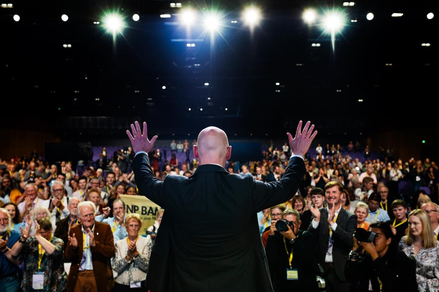 SNP leader John Swinney at the party conference in Edinburgh, in front of clapping crowd